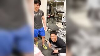 Touching his friend’s cock in the middle of the gym